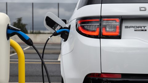 White Land Rover Discovery Sport P300e on charge