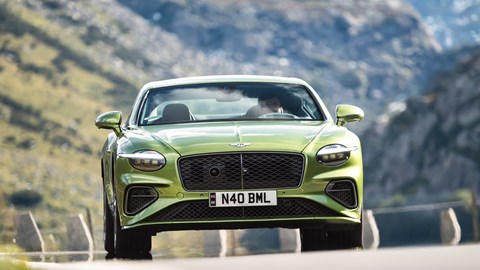 Bentley Continental GT Speed plug-in hybrid - dead-on front, green, driving, cresting hill
