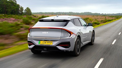 Kia EV6 facelift review: rear three quarter driving, grey paint
