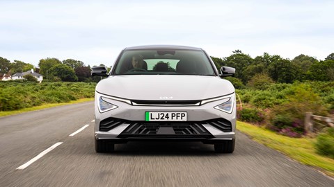 Kia EV6 facelift review: front view driving, grey paint