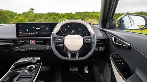Kia EV6 facelift review: steering wheel and infotainment system, black and white leather upholstery