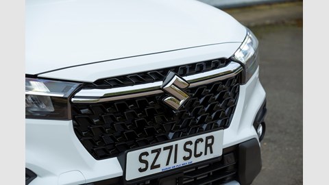 Suzuki S-Cross (2022) review: radiator grille and front badge, white car
