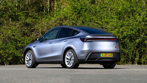 Tesla Model Y (2025) review: rear three quarter static, silver paint