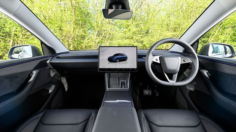 Tesla Model Y (2025) review: dashboard and infotainment system, black faux leather upholstery