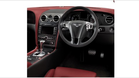 Bentley Continental Supersports interior photo: more carbonfibre, lovely padded quilted leather on the door cards