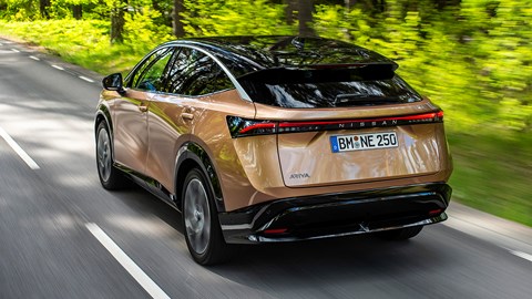 Nissan Ariya electric SUV review, rear view, driving in countryside