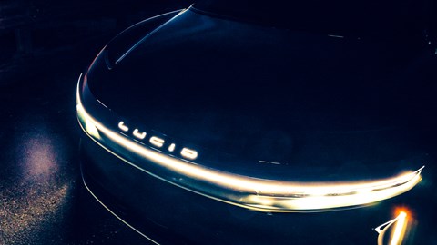 Full-width light bar and branding provide distinctive signature at night