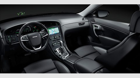 The cabin of the new Saab 9-5 rocks. This is a comfy place to sit. Note the head-up display and unidirectional air vents whose motif flows around the instrument pack. Cool