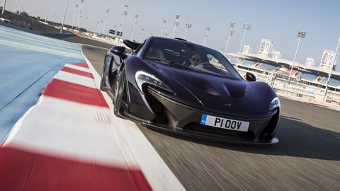 McLaren P1 review, Bahrain, black, front view, driving on circuit