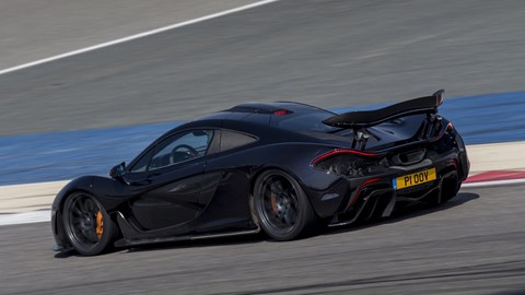 McLaren P1 review, Bahrain, black, rear-view, driving on circuit