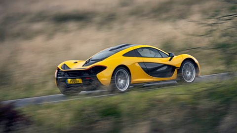 McLaren P1 review, yellow, rear view, driving