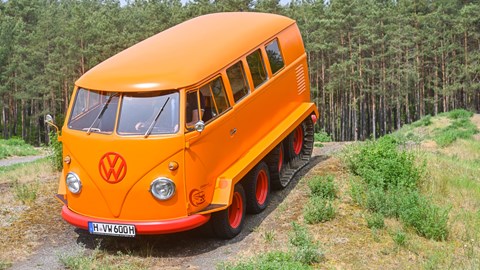 Volkswagen Half-Track Fox, orange, driving over hill