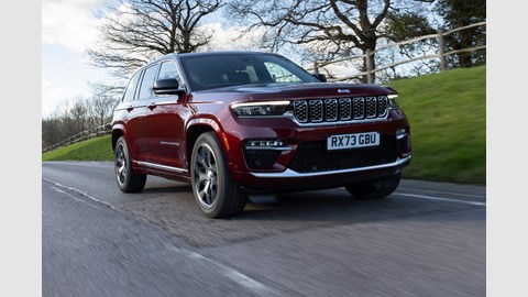 Jeep Grand Cherokee review - front, red, driving on road