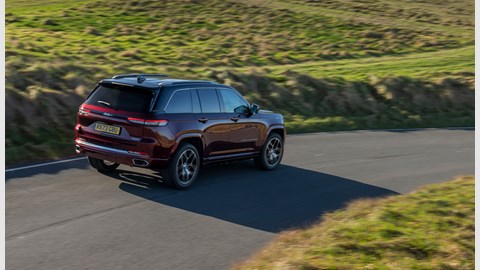 Jeep Grand Cherokee review - rear, red, driving on road