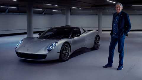 Gordon Murray CBE standing next to T.33 supercar