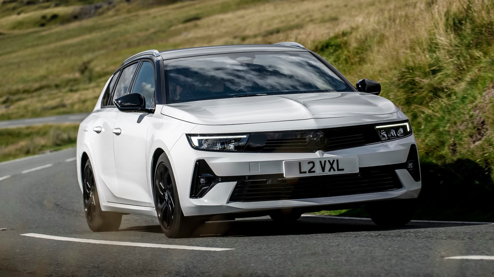 Vauxhall Astra Sports Tourer review - front, white, driving round corner
