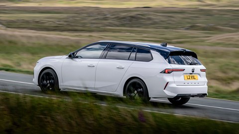 Vauxhall Astra Sports Tourer review - rear side, white, driving