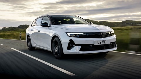 Vauxhall Astra Sports Tourer review - front, white, driving at sunset