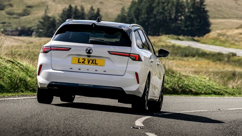 Vauxhall Astra Sports Tourer review - rear, white, driving round corner