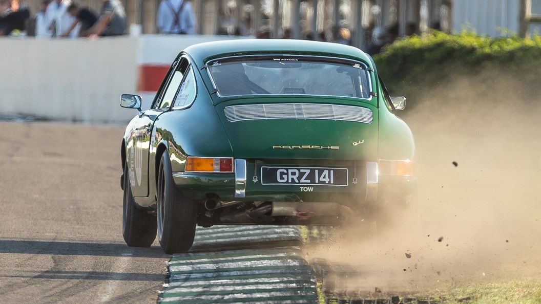 Porsche 911 classic racer, powerslide, during the Fordwater Trophy at the 2023 Goodwood Revival