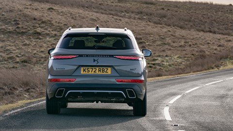 DS 7 (2023) review: rear cornering shot, grey car, arid background