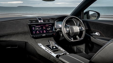 DS 7 (2023) review: steering wheel and driver's seat, black and grey upholstery