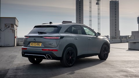 DS 7 (2023) review: rear three quarter static, grey car, city background