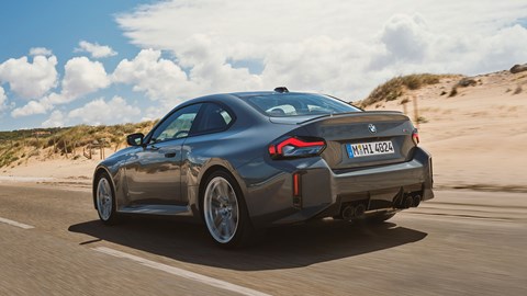 Refreshed BMW M2 Coupe: rear three quarter driving, grey paint