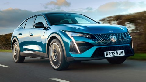 Peugeot 408 crossover review on CAR magazine - front view, driving, blue skies