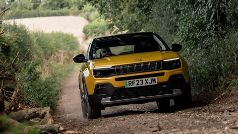 Jeep Avenger (2025) review: front three quarter driving, yellow paint, off-road trail