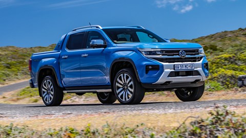 VW Amarok review, front view, blue, driving round corner