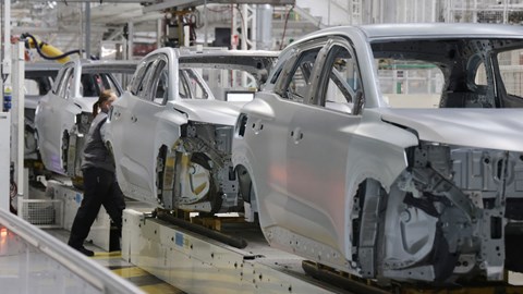 Renault factory: doors, bonnets and boot lids being bolted to body shells