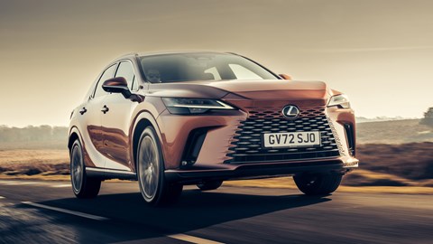 Lexus RX 450h+ (2023) review: front three quarter tracking shot, bronze car, country lane