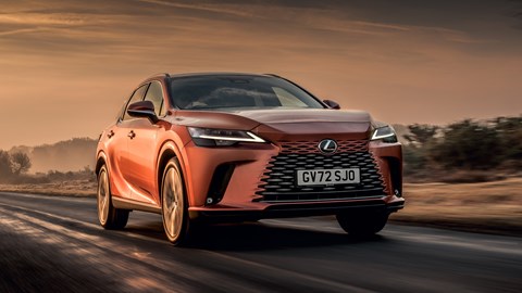 Lexus RX 450h+ review: front three quarter tracking shot, bronze car, sunset road
