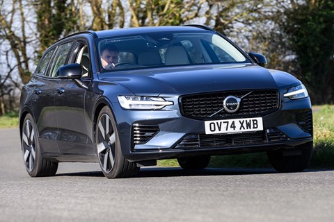 Image of a blue Volvo V60 driving round a right hand corner, viewed from the front right corner
