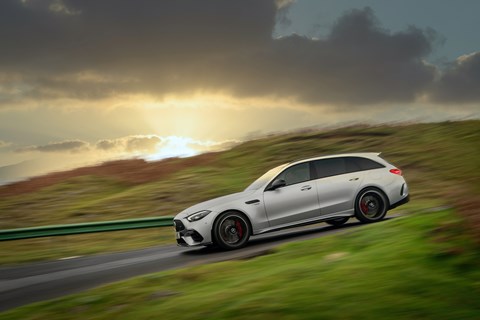 image of a silver Mercedes-A<G C63 driving round a right-hand hairpin, viewed from the right side