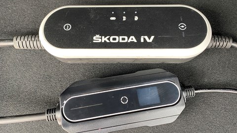 A Skoda 13A charging cable alongside a generic third-party cable. The difference in physical build is immediately apparent.