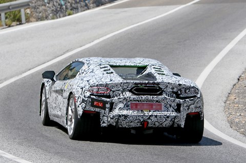 Note high-mounted, gigantic central-mounted exhaust pipe on Lambo V8