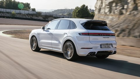 Porsche Cayenne E-Hybrid review - 2023-facelift - Turbo E-Hybrid, white, rear, driving on racing circuit
