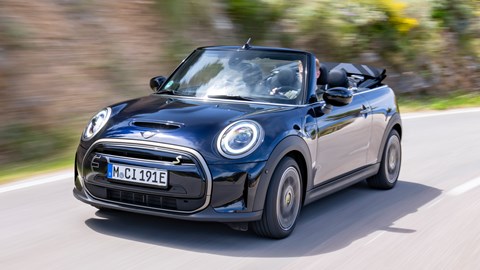 MINI Electric Convertible (2023): front three quarter driving, high angle, Mallorca road, black paint