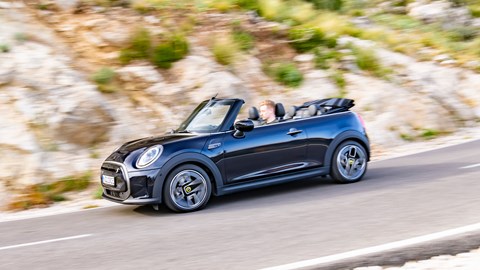 MINI Electric Convertible (2023): side view driving, Mallorca road, black paint