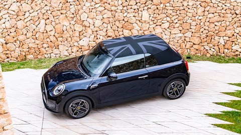 MINI Electric Convertible (2023): front three quarter static, high angle, roof up, black paint