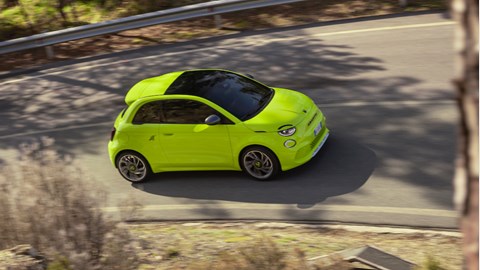 Abarth 500e yellow front three dynamic