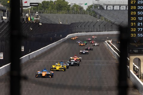 IndyCars practicing on the Indianapolis 500 race track