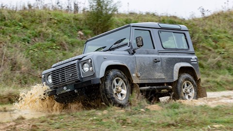 Electrogenic Land Rover Defender EV conversion, grey, driving off-road