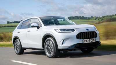 Honda ZR-V (2023) review: front three quarter driving, low angle, country lane, white