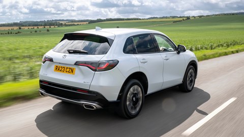 Honda ZR-V (2023) review: rear three quarter driving, high angle, country lane, white