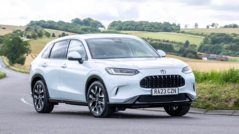 Honda ZR-V (2023) review: front three quarter cornering, low angle, left-hand turn, country lane, white