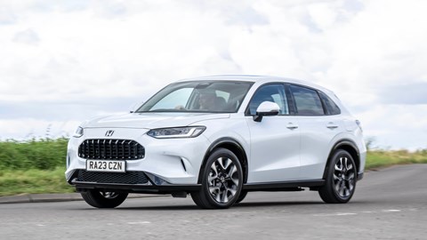 Honda ZR-V (2023) review: front three quarter cornering, low angle, right-hand turn, country lane, white