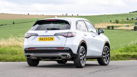 Honda ZR-V (2023) review: rear three quarter cornering, low angle, body roll, country lane, white